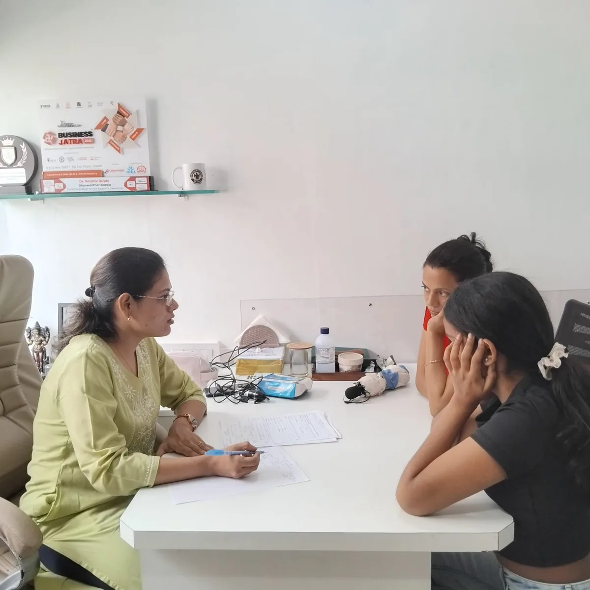 Dr. Aditi consulting a patient
