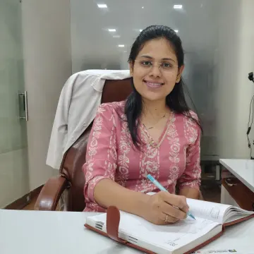Dr. Aditi at her clinic desk